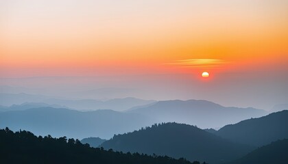 Obraz premium Orange and Blue Sunset over Misty Mountain Range
