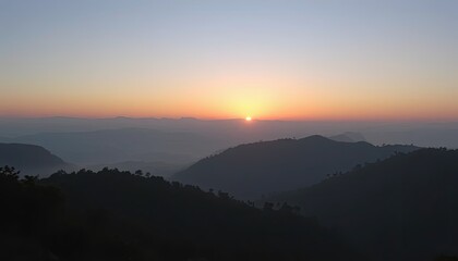 Obraz premium Sunrise Over Misty Mountain Range