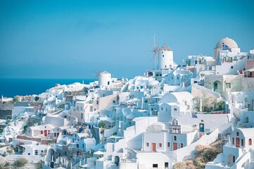 Fototapeta premium Santorini's iconic whitewashed architecture under a blue sky