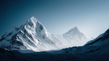 Snowy Mountain Peaks Under Clear Blue Sky, Adventure Travel Concept