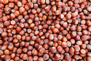 whole hazelnuts in bulk, top view, background