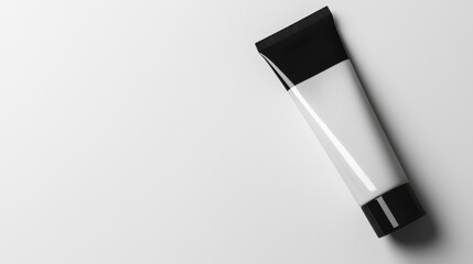Minimalistic black and white cosmetic tube on white background