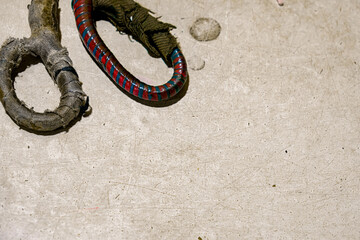 Worn fabric scissor handles on a textured surface