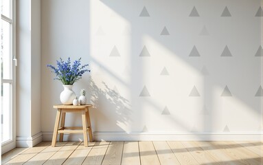 Bright and airy minimalist room interior with wooden floor, white walls with triangle pattern, and blue flowers in a vase on a stool.