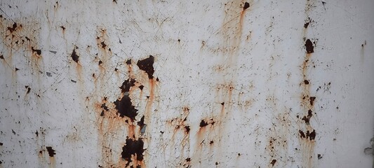 Rust on the iron door for the background. old peeling paint on rusty gates.