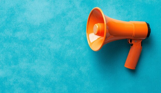 Orange megaphone on teal background (1)