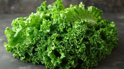 Fresh, green kale heap, curly leaves, dark backdrop