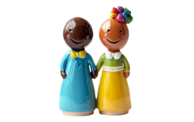 Close up of colorful LGBTQ wedding cake topper figurines smiling and celebrating love and unity isolated on white background PNG