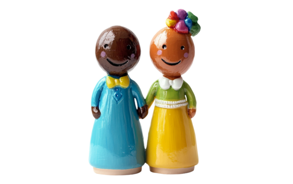 Close up of colorful LGBTQ wedding cake topper figurines smiling and celebrating love and unity isolated on white background PNG - Powered by Adobe