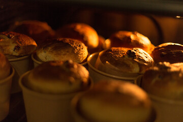 Close-up of traditional Easter bread kulich, freshly baked at home. Warmth and joy of homemade holiday treats. Family celebration, and the time-honored ritual of preparing Easter pastries with love.