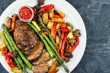 Roasted duck breast with vegetables.