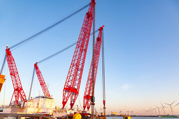 A huge floating crane in the seaport.