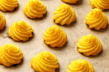Duchess potatoes, mashed potatoes piped in decorative swirls