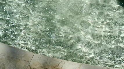 drops of water in a fountain on a sunny day.
Transparent and cool water in a fountain.
Artificial water.
Pool with water.
Pump room with water in a park.
Recreation area