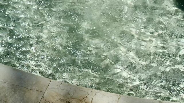 drops of water in a fountain on a sunny day.
Transparent and cool water in a fountain.
Artificial water.
Pool with water.
Pump room with water in a park.
Recreation area
