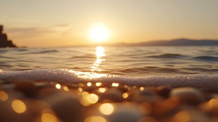 Sunset over water, golden hues reflecting on gentle waves, serene beach setting perfect for relaxation and inspiration.