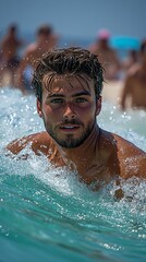 Man swimming in ocean wave, beach crowd background, summer vacation
