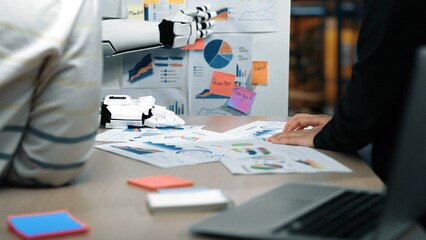 A unique workspace scene illustrates the collaboration between human and robot in data analysis,...