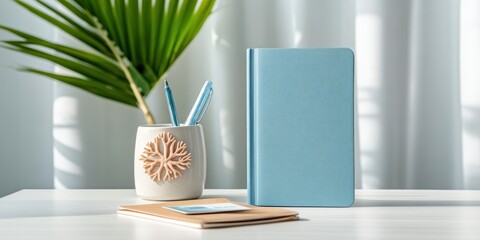 ocean-inspired workspace, simple desk with world oceans day badge, planner, and coral pen, with ocean breeze curtain movement in the background