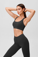 Fototapeta premium Fitness woman. Athletic girl on the gray background