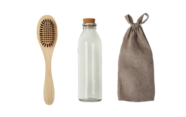 Flat lay of eco-friendly products including a bamboo brush, showcasing sustainable living essentials isolated on white background PNG
