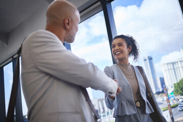 Fototapeta premium Business people, handshake and lawyer in office with introduction for partnership, greeting or collaboration. Merger, teamwork and attorney woman with man shaking hands for deal, trust or agreement
