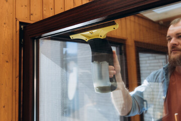 Window cleaning process using a handheld device for streak-free shine in home environment cleaning...