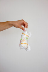 Diaper waste, dirty diapers. Disposal of used baby diapers