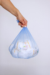Diaper waste, dirty diapers. Disposal of used baby diapers