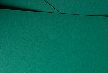 Fototapeta premium Matte paper texture with vibrant emerald and jewel green tones, sleek geometric lines and minimalistic design, offering a clean, smooth surface and premium finish, creating an elegant, modern backdrop