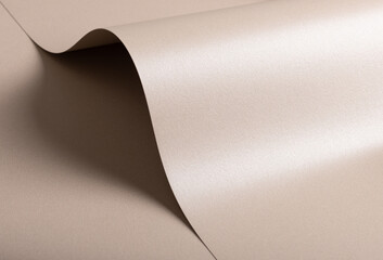 Paper texture with soft beige and pink tones, glossy pearlescent surface with shimmering glitter...