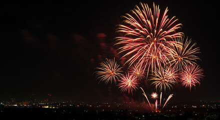 Fireworks exploding over city skyline at night, perfect for celebration graphics, holiday promotions, and event banners