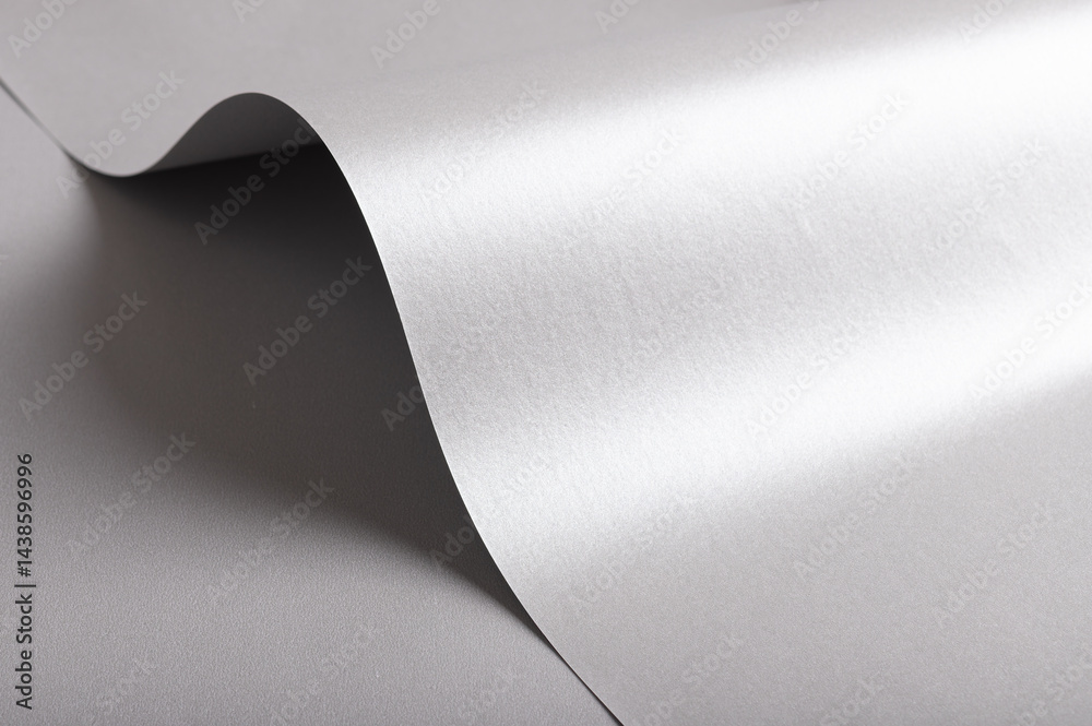 Poster silver and gray paper texture with metallic gloss, sleek folded and rolled design, wavy edge and pea