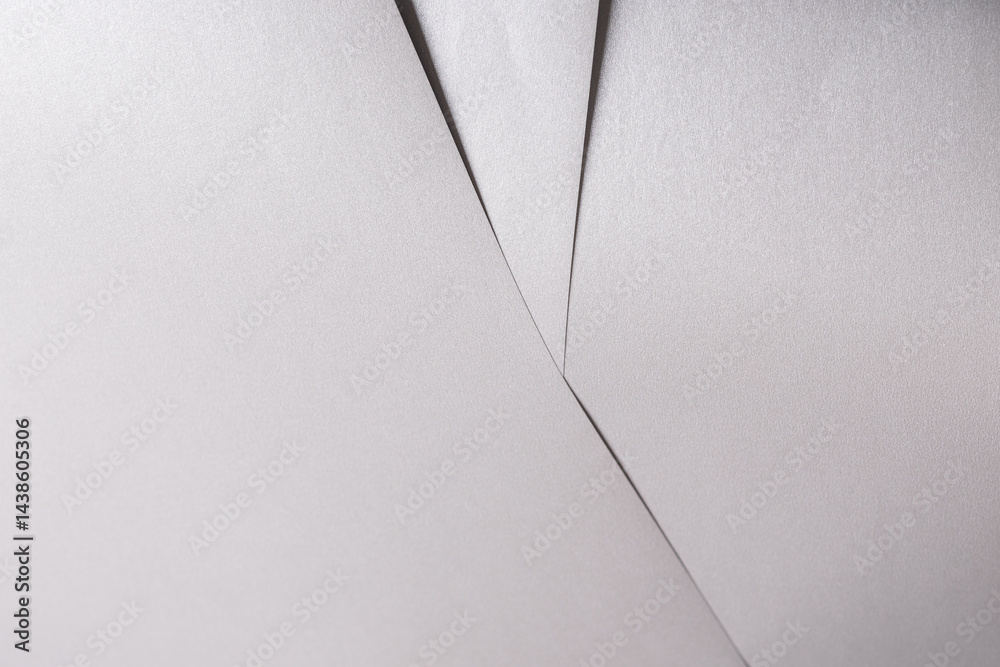 Poster white paper texture with metallic silver and platinum tones, glossy finish and smooth folded surface