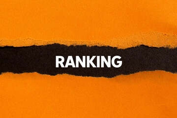 Ranking message written on ripped torn orange paper on black background. Conceptual ranking symbol....