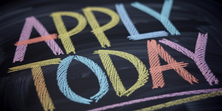 Close-up of colorful chalk lettering on blackboard, spelling "Apply Today", suggesting urgency and action, ideal for recruitment or job application campaigns