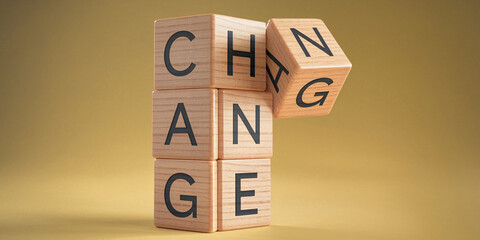 Wooden cubes spelling CHANGE, one cube tilting, suggesting transformation or transition Concept of change, progress, and adaptation