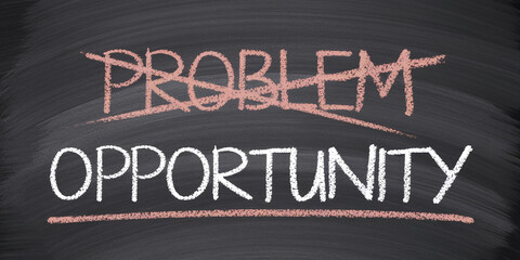Chalkboard with "problem" crossed out and "opportunity" written below, symbolizing transformation and positive thinking