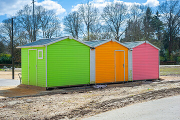 Naklejka premium Wooden cabins painted in bright italian ice colors