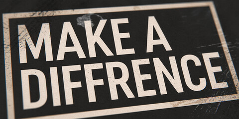 Close-up of textured black background with framed text "Make a Difference" in off-white, conveying a message of social impact and motivation