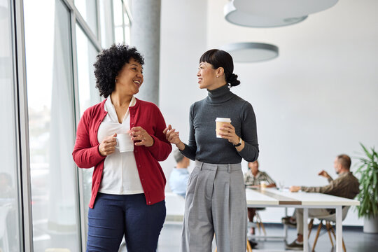 business meeting businesswoman woman young office presentation colleague teamwork standing walking conference seminar break coffee