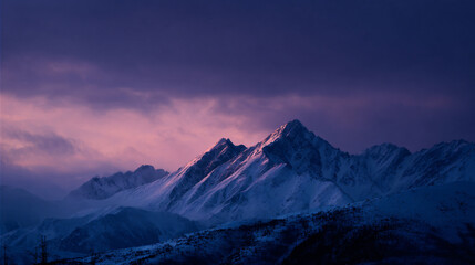 Fototapeta premium Snow-covered mountain peaks at dawn under a soft pastel sky.