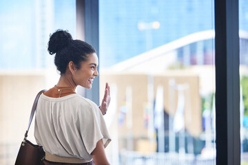 Airport, smile and wave with business woman at window in terminal for departure, travel or trip....