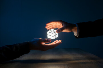 Passing Glowing Cube Between Two Hands in Dark Environment