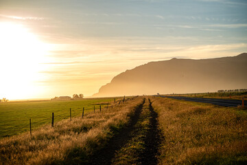Fototapeta premium Molten Gold Over Lava Fields: Iceland’s Surreal Sunset Transformations