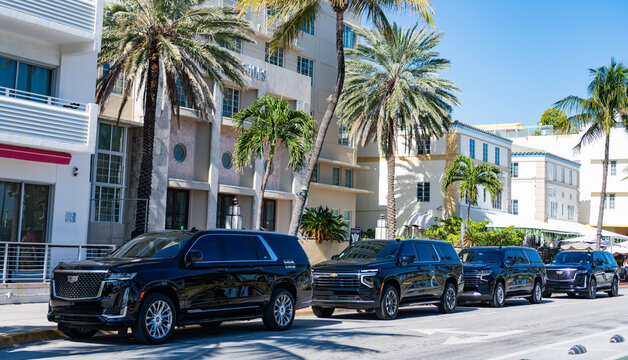 Miami, Florida, USA - December 06, 2024: Cadillac Escalade 2022 SUV car. Luxury SUV car of Cadillac Escalade at building. Car of Cadillac Escalade parked outdoor. Cadillac Escalade, side view