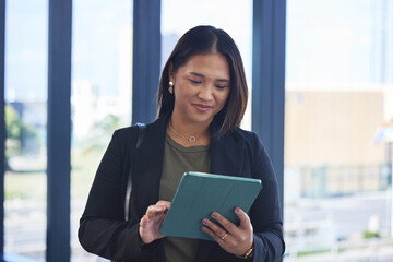 Asian woman, tablet and online for marketing project in office, social media manager and...