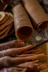 Natural fruit leather rolls made from apple juice. Healthy, vegan, sugar-free dried snacks on a rustic table. Perfect for clean eating and dieting.