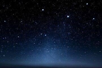 Obraz premium Dark Inky Sky: Celestial Canvas - Starry night, cosmic expanse, celestial bodies, dark blue, nocturnal scene. Symbolizing mystery, wonder, infinity, dreams, peace