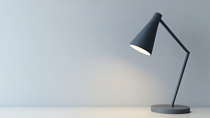 A contemporary cone-shaped desk lamp in matte gray with a slim metal arm